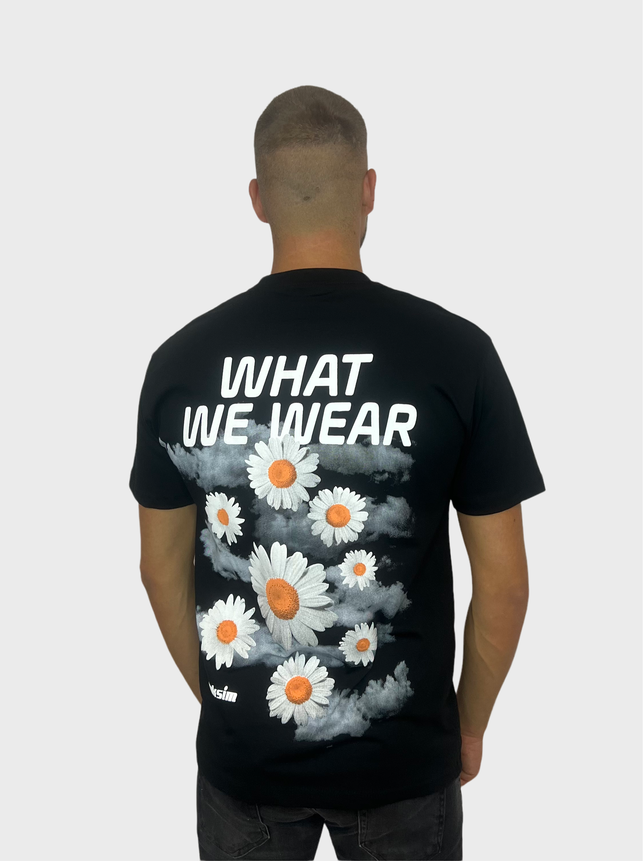 What We Wear T-Shirt - Zwart