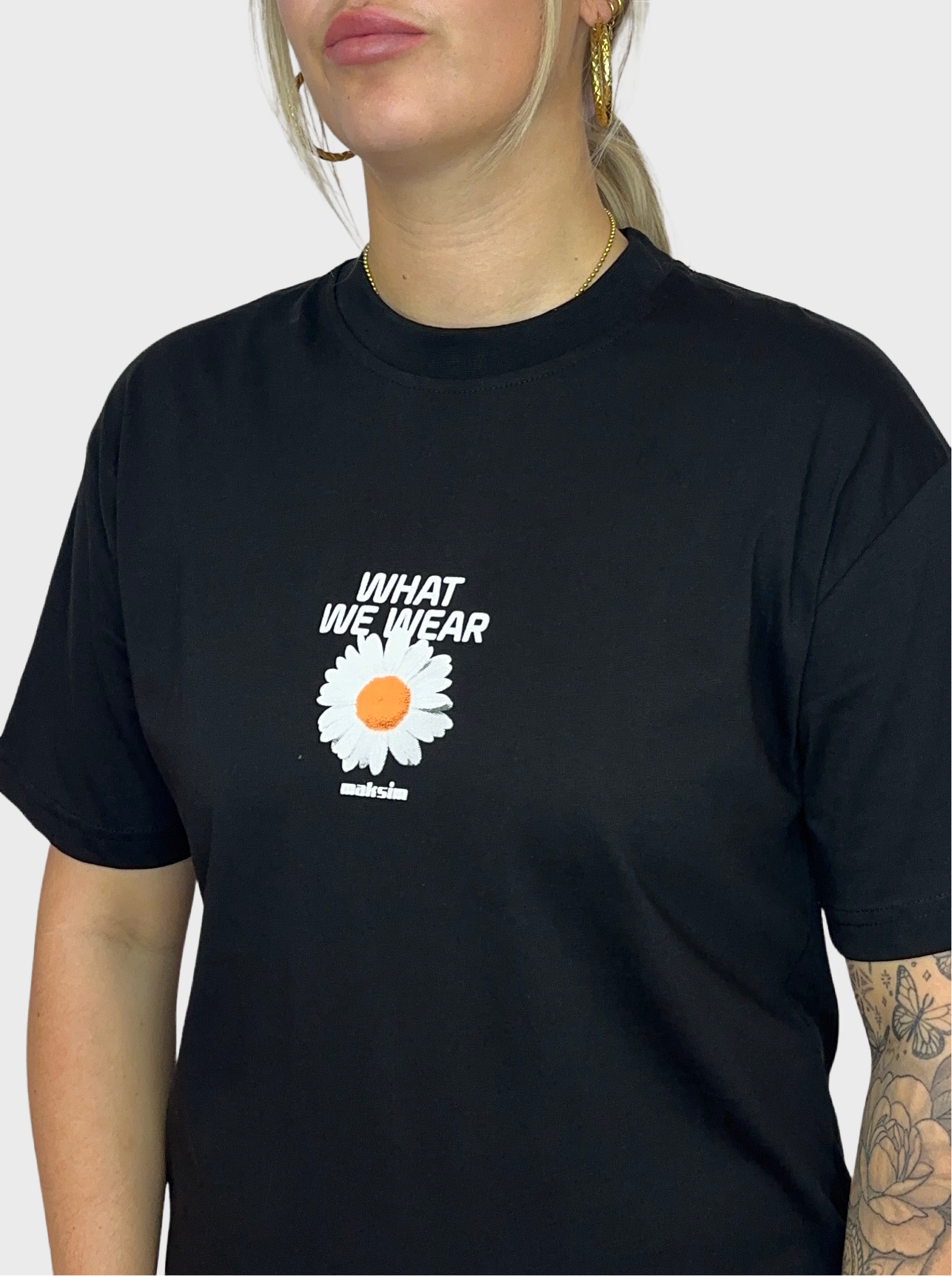 What We Wear T-Shirt - Zwart