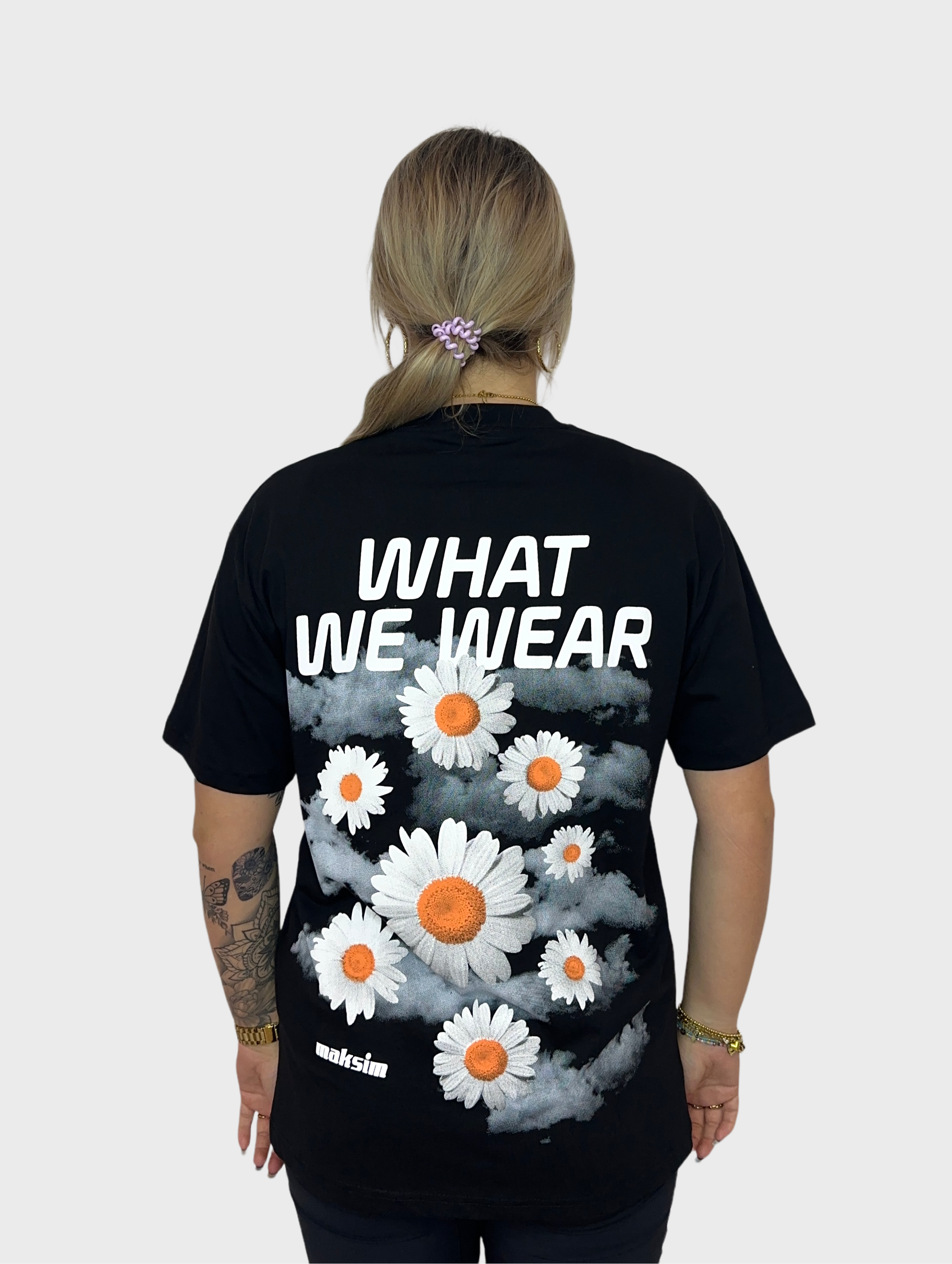 What We Wear T-Shirt - Zwart